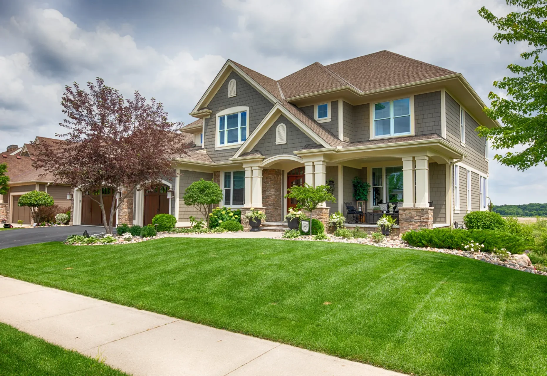 Spacious craftsman-style home with manicured lawn