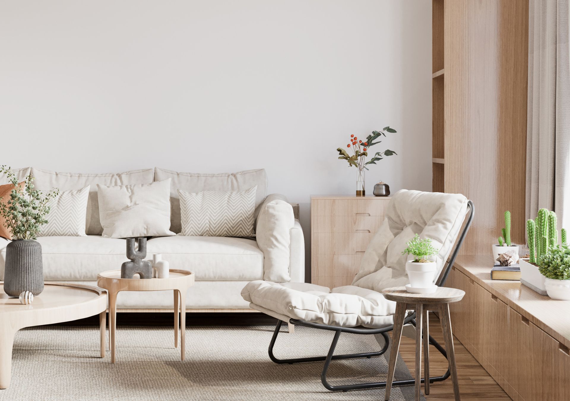 Sunny living room with white sofa, lounge chair and plants